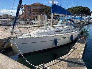 Beneteau Oceanis Clipper 331 2001 Beneteau Oceanis Clipper 331 sailboat docked in marina, blue sail cover, calm water.