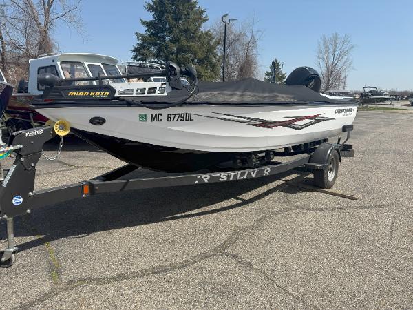 Crestliner 1750 Bass Hawk 2019 Crestliner 1750 Bass Hawk boat on trailer, parked outdoors.