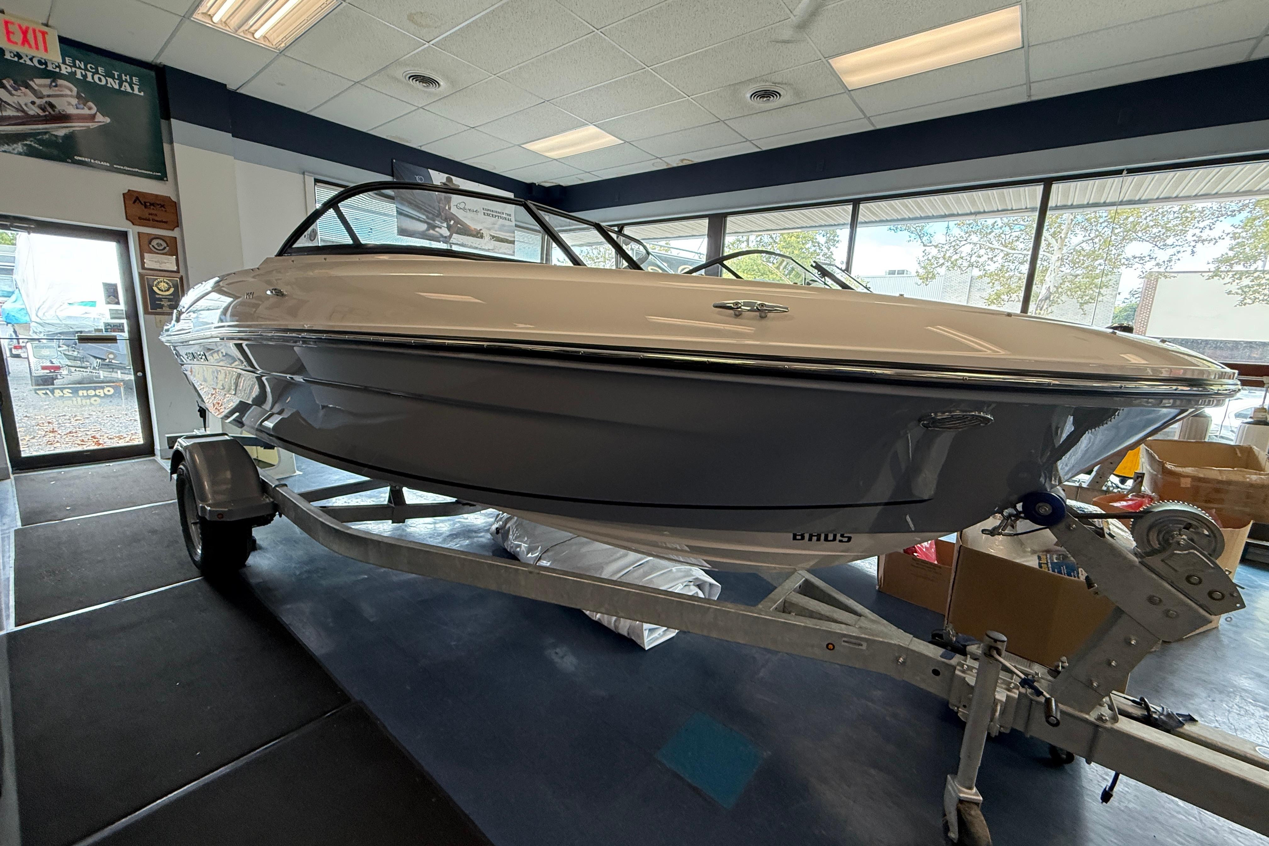 Bayliner VR4 Bowrider OB 2025 Bayliner VR4 Bowrider OB displayed indoors on a trailer.