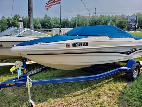 Larson 180 Sport 2008 Larson 180 Sport boat on trailer with blue cover.