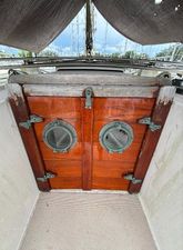Island Packet 38 1987 Island Packet 38 sailboat with wooden hatch doors and portholes.