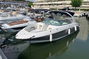 Chaparral 276 SSX 2007 Chaparral SSX 276 boat docked in a marina, featuring sleek design and spacious seating.