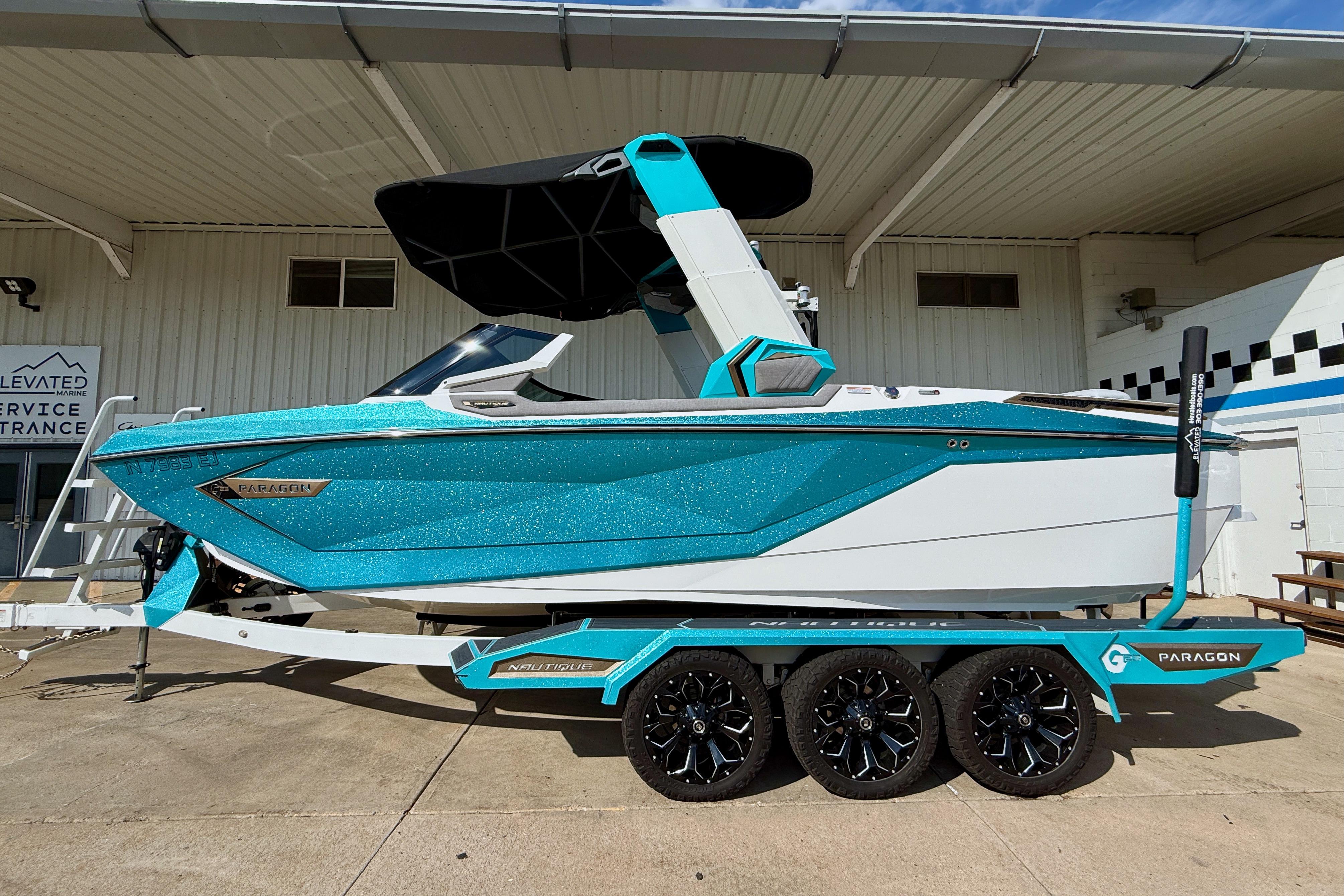 Nautique Super Air Nautique G23 Paragon 2021 Nautique Super Air Nautique G23 Paragon boat on trailer, vibrant blue and white design.