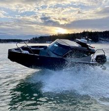 G-Force G-Force 8 G-Force 8 boat 2024 model cruising on water at sunset.