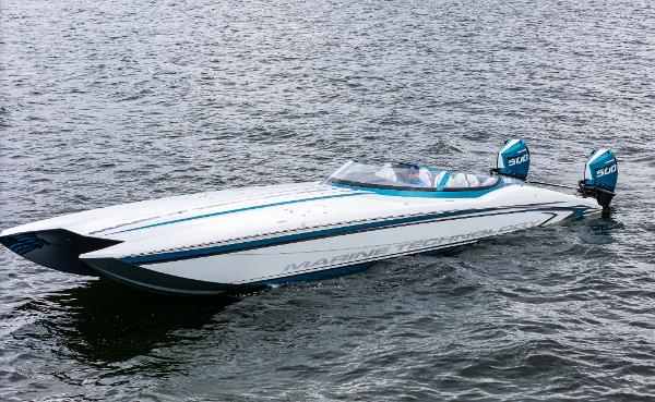 MTI 440X 2026 MTI 440X speedboat on water, featuring sleek design and dual outboard engines.