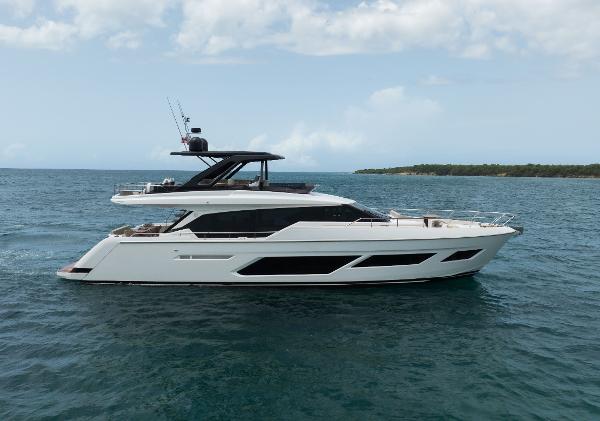 Ferretti Yachts 720 2023 Ferretti Yachts 720 cruising on open water under a cloudy sky.