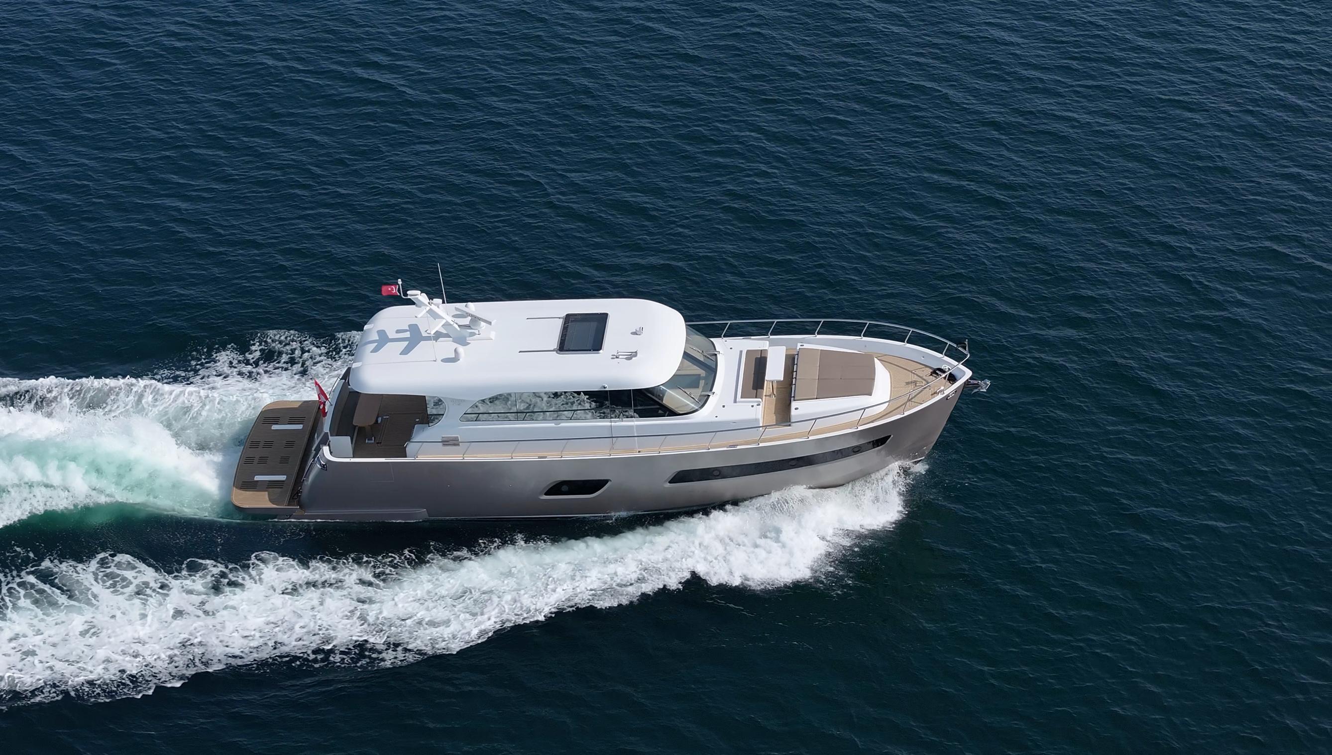 Altima Express Coupe 65 2025 Altima Express Coupe 65 yacht cruising on open sea.