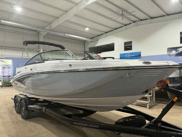 Monterey M4 2025 Monterey M4 boat on trailer in indoor showroom setting.