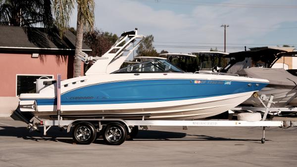 Chaparral 227 SSX SURF 2017 Chaparral 227 SSX SURF boat on a trailer in a parking lot.