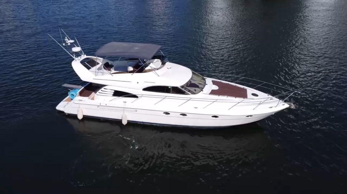 Fairline Squadron 55 2001 Fairline Squadron 55 yacht cruising on calm waters.