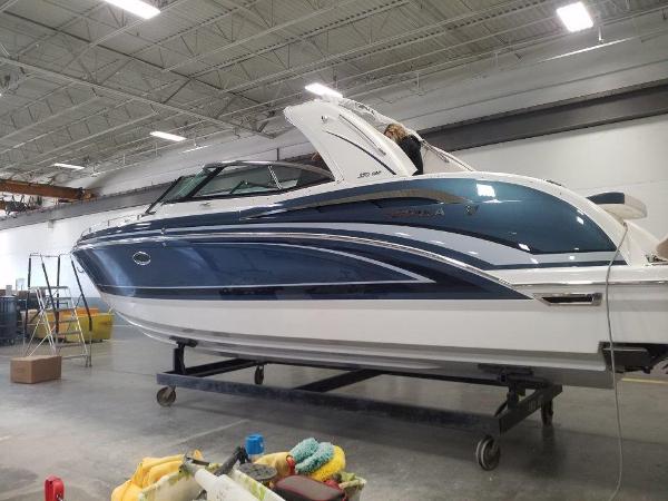 Formula 350 Crossover Bowrider 2021 Formula 350 Crossover Bowrider in a warehouse, side view.