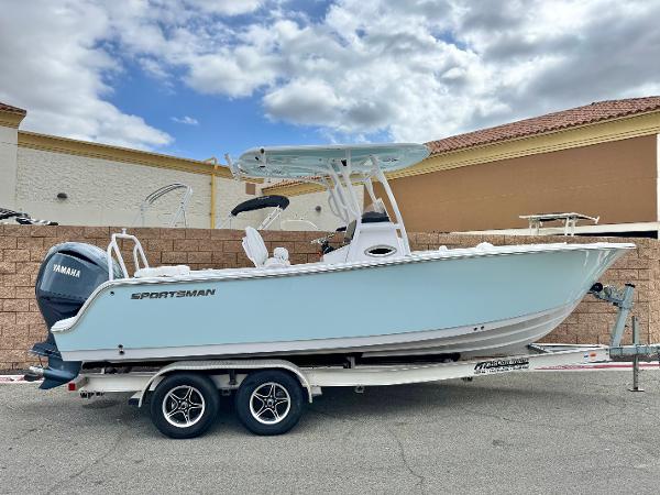 Sportsman Heritage 241 Center Console 2022 Sportsman Heritage 241 Center Console boat on trailer, parked outdoors under cloudy sky.