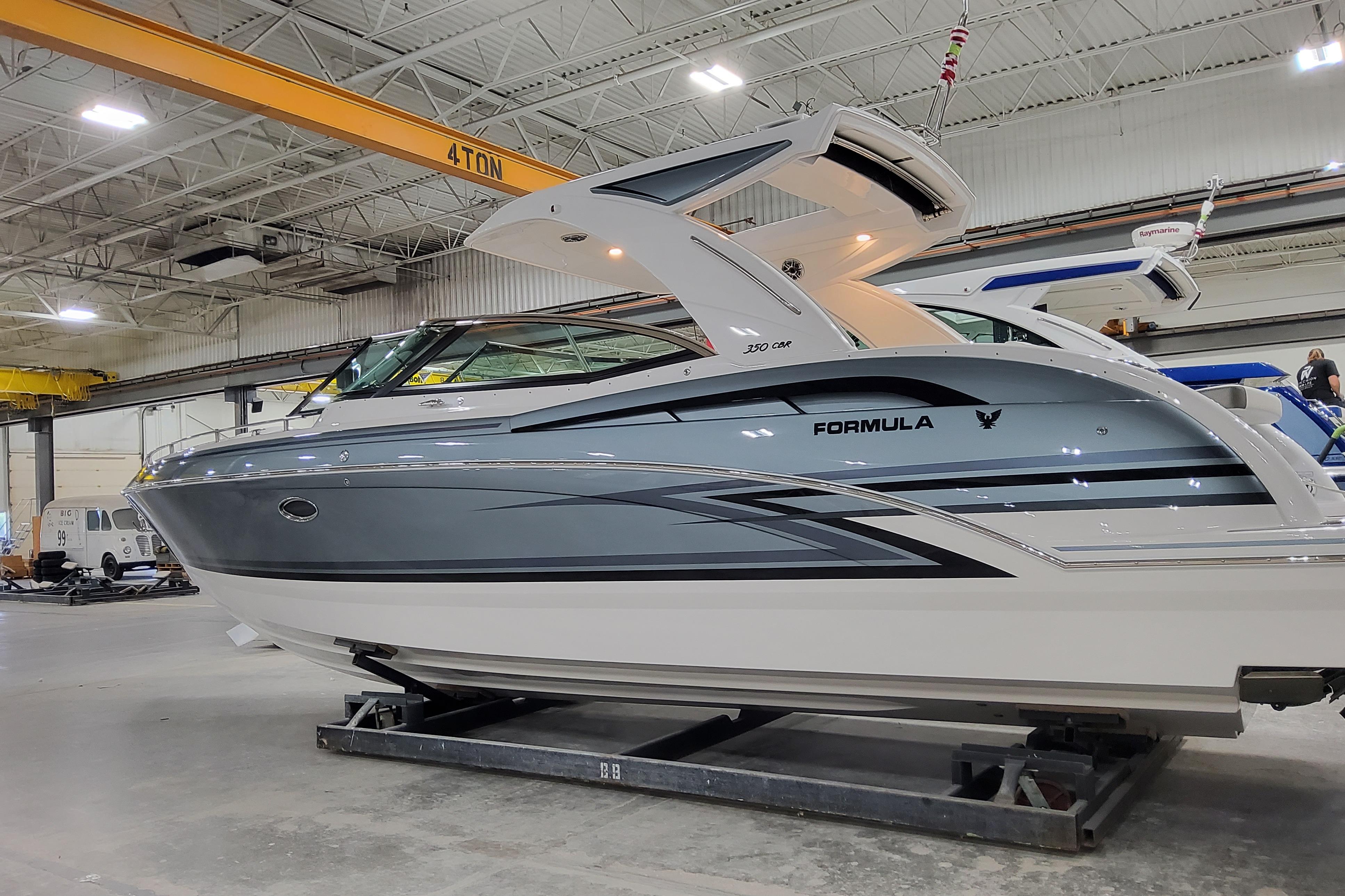 Formula 350 Crossover Bowrider I/O 2025 Formula 350 Crossover Bowrider I/O in a showroom, showcasing sleek design and modern features.