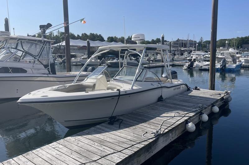 Key West 239 DFS 2021 Key West 239 DFS boat docked at a marina on a sunny day.