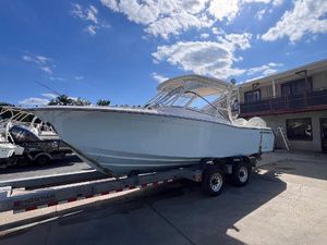 Grady-White Freedom 275 2025 Grady-White Freedom 275 boat on trailer under a sunny sky.