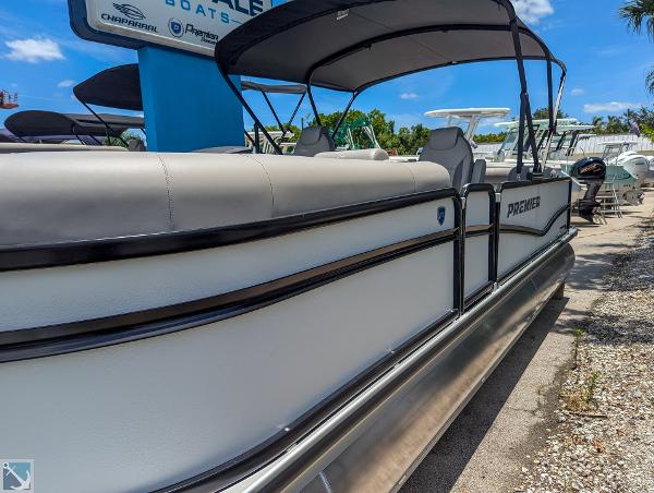 Premier 230 Sunsation RE 2024 Premier 230 Sunsation RE pontoon boat at a dealership.