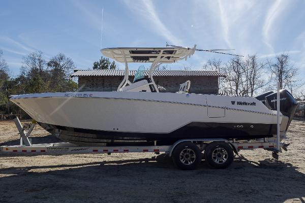 Wellcraft 262 Fisherman 2019 Wellcraft 262 Fisherman boat on trailer, parked outdoors.