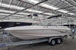 Chaparral 210 SSi 2003 Chaparral 210 SSi boat on trailer in indoor storage facility.