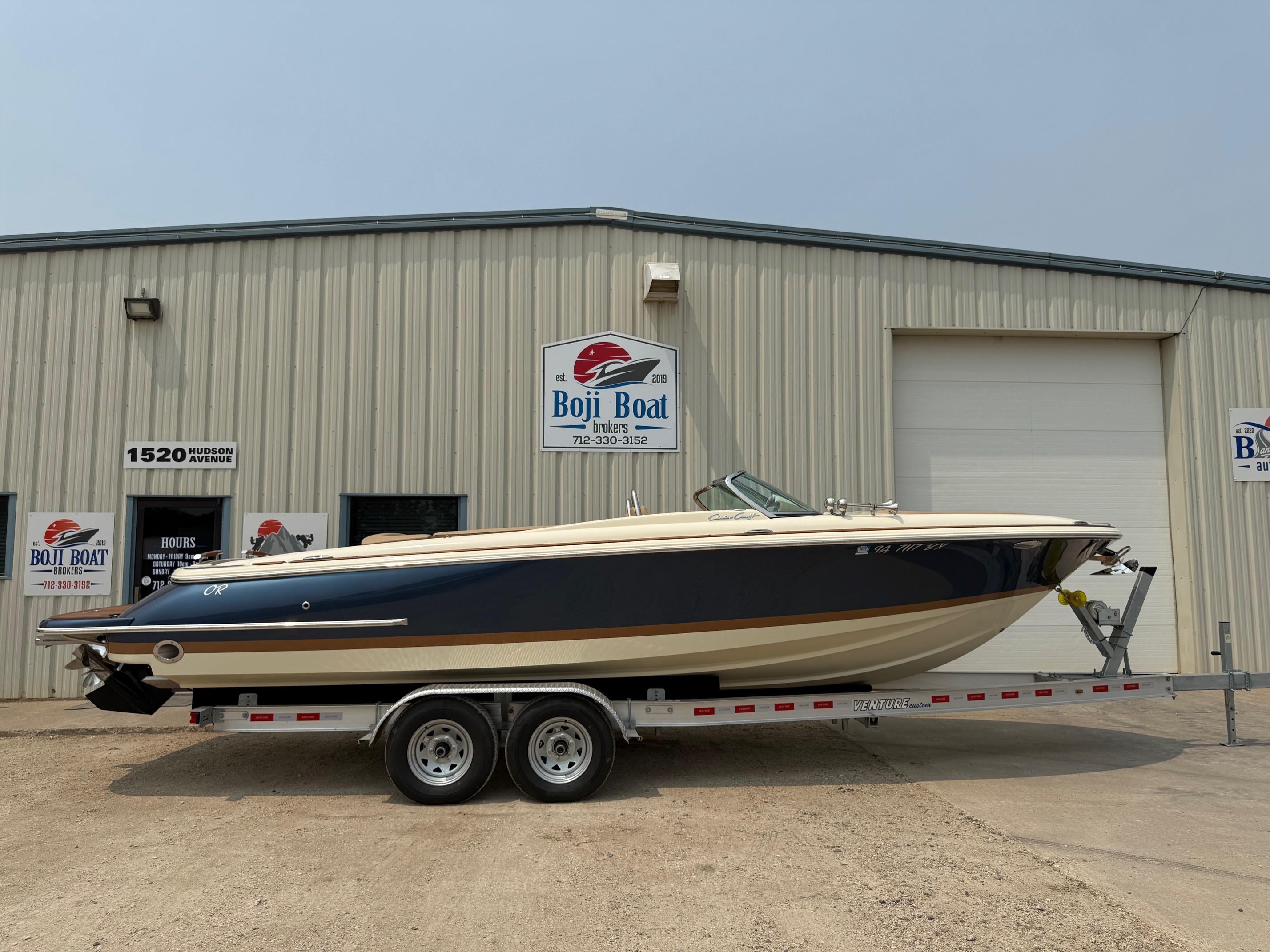 Chris-Craft Launch 27 2021 Chris-Craft Launch 27 boat on trailer outside Boji Boat Brokers building.