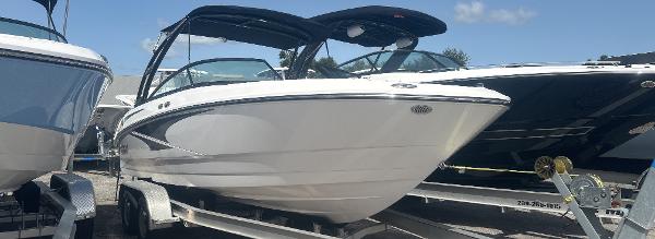 Monterey M-225 2025 Monterey M-225 boat on trailer, sleek design, sunny day.