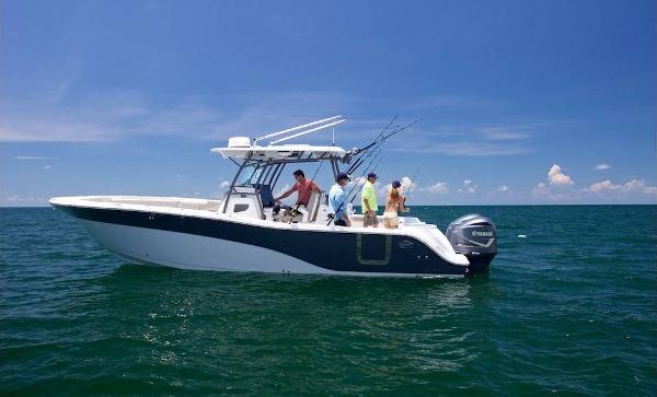 Sea Fox 288 Commander 2021 Sea Fox 288 Commander boat on open water, people fishing under clear blue sky.