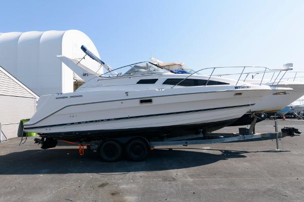 Bayliner 2855 Ciera 1998 Bayliner 2855 Ciera boat on a trailer in a marina.