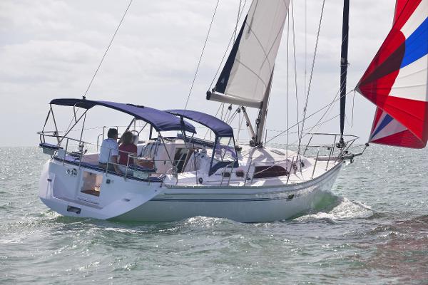 Catalina 386 2025 Catalina 386 sailboat navigating open waters with colorful sails.