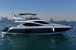 Sunseeker Manhattan 60 2009 Sunseeker 60 Manhattan yacht on water with city skyline in background.