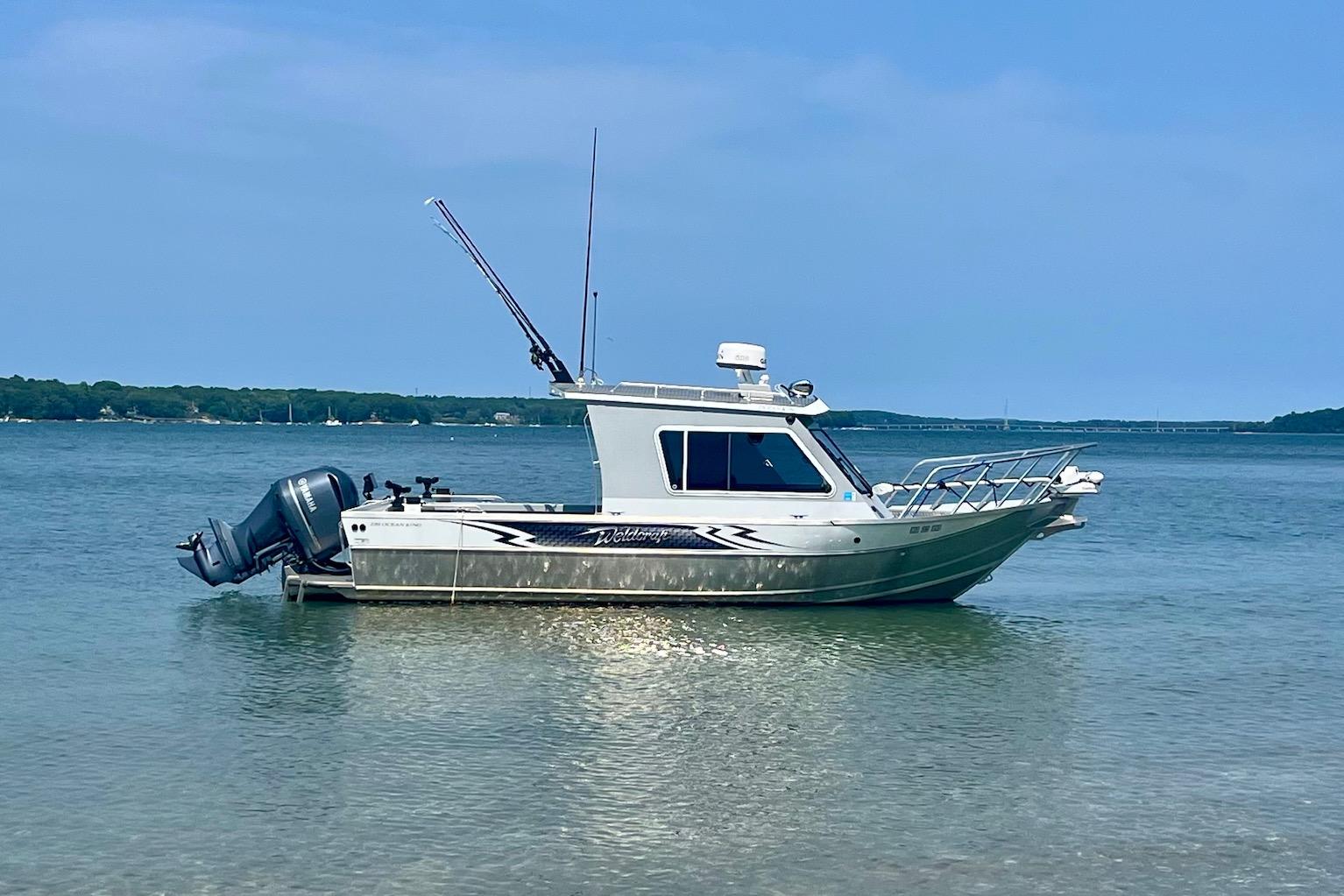 Weldcraft Ocean King 220 2023 Weldcraft Ocean King 220 boat anchored in calm waters.