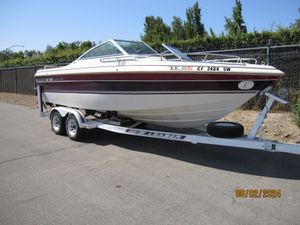 Cobalt 21 Bowrider Classic 1990 Cobalt 21 Bowrider Classic boat on trailer, parked outdoors.
