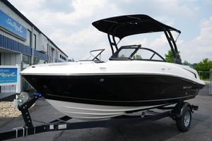 Bayliner VR5 Bowrider I/O 2024 Bayliner VR5 Bowrider I/O boat on trailer, black and white design, parked outdoors.