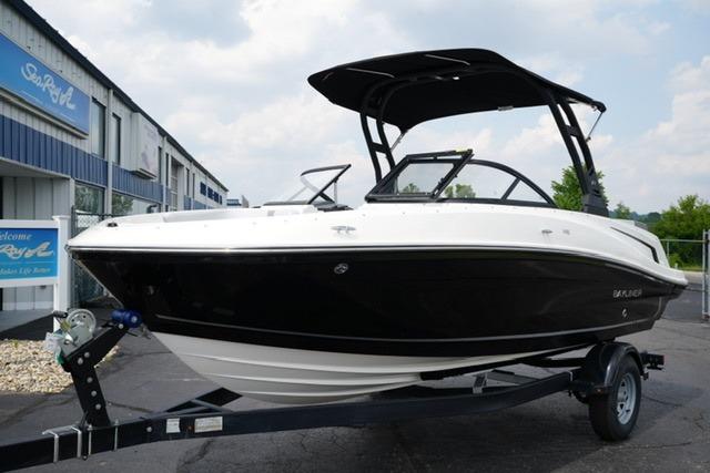 Bayliner VR5 Bowrider I/O 2024 Bayliner VR5 Bowrider I/O boat on trailer, black and white design, parked outdoors.