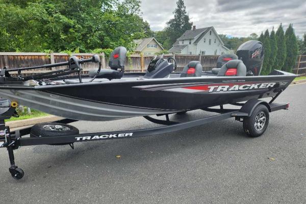 Tracker Pro Team 195 Tournament Edition 2025 Tracker Pro Team 195 Tournament Edition boat on trailer, parked on street.