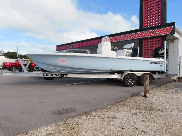 Contender 23 Bay 2025 Contender 23 Bay boat on trailer at dealership.
