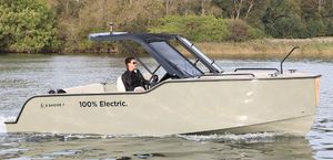 X Shore 1 Top 2023 X Shore 1 Top electric boat cruising on a serene lake.