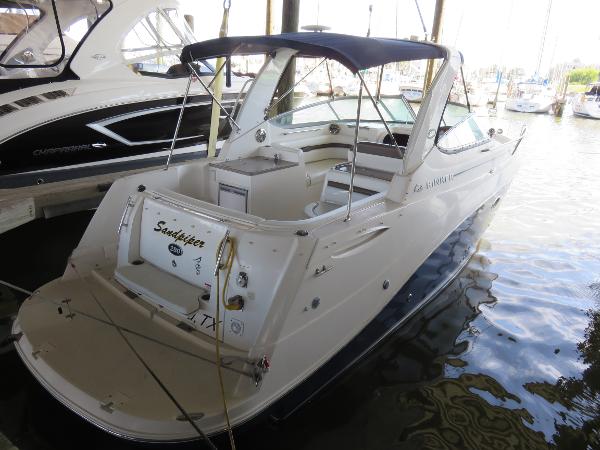 Rinker 280 Express Cruiser 2008 Rinker 280 Express Cruiser docked at marina, rear view.