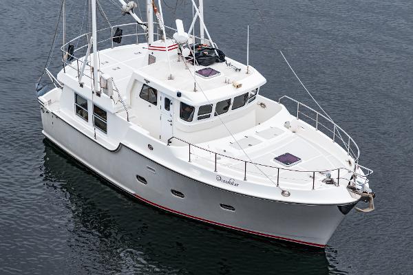 Nordhavn 40 II 2006 Nordhavn 40 II yacht on calm water, showcasing sleek design and spacious deck.