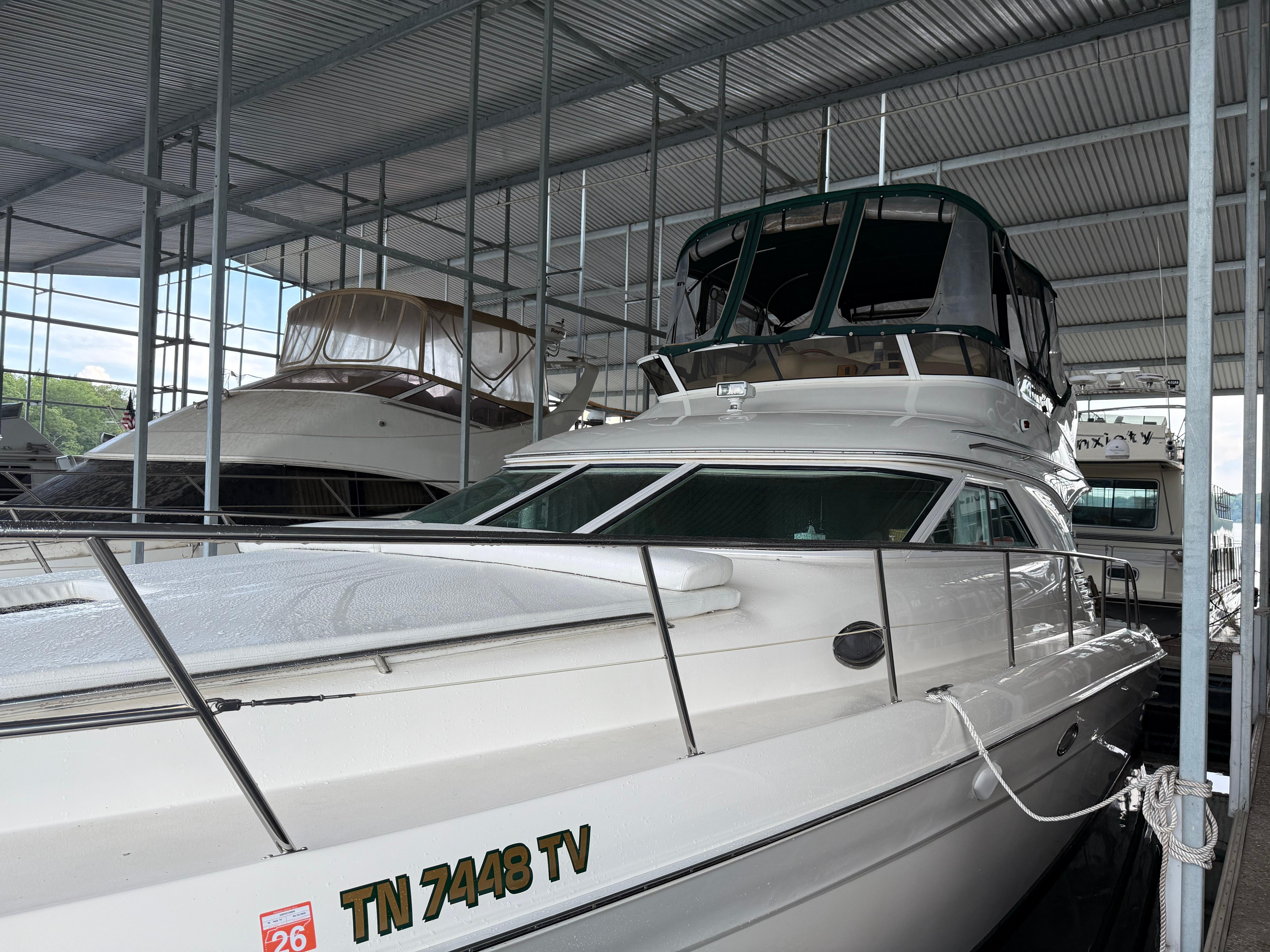 Sea Ray 400 Sedan Bridge 1999 Sea Ray 400 Sedan Bridge yacht docked in a covered marina.