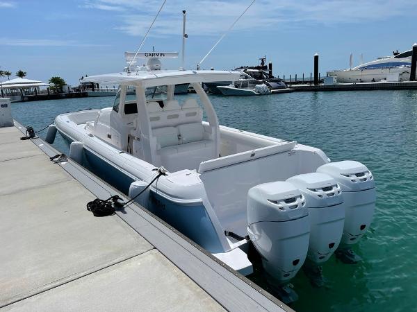 Intrepid 407 Nomad SE 2022 Intrepid 407 Nomad SE boat docked with triple outboard engines.