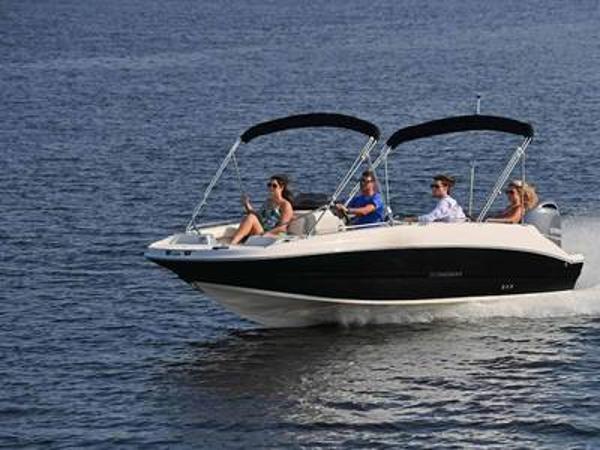 Stingray 192SC 2025 Stingray 192SC boat cruising on open water with passengers.