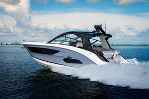 Sea Ray Sundancer 370 Outboard 2023 Sea Ray Sundancer 370 OB cruising on open water.
