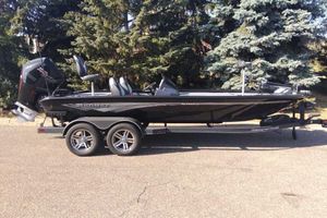 Ranger ALPHA 208 2025 Ranger ALPHA 208 boat on trailer, parked outdoors near trees.