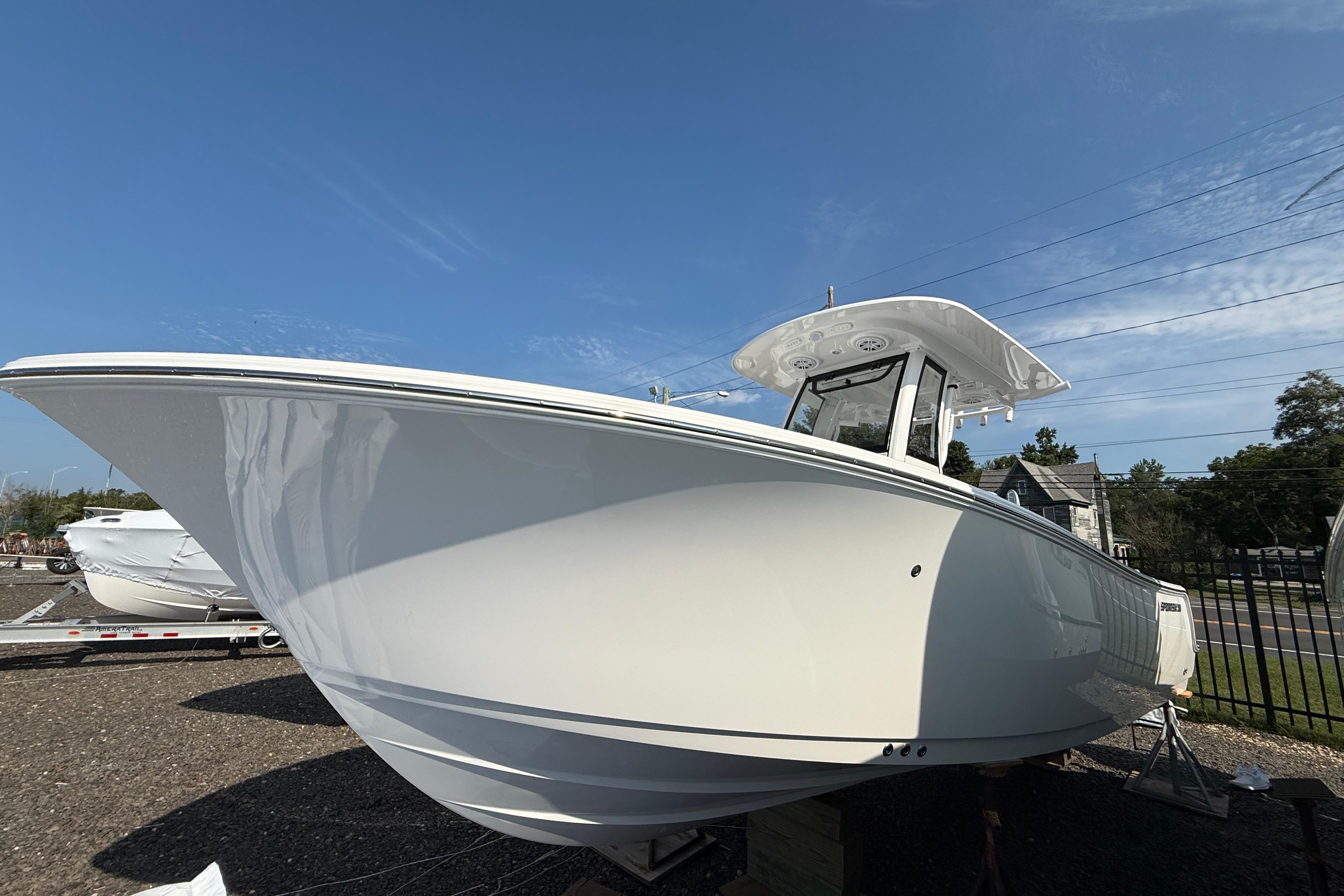 Sportsman Heritage 231 Center Console 2026 Sportsman Heritage 231 Center Console boat under clear blue sky.