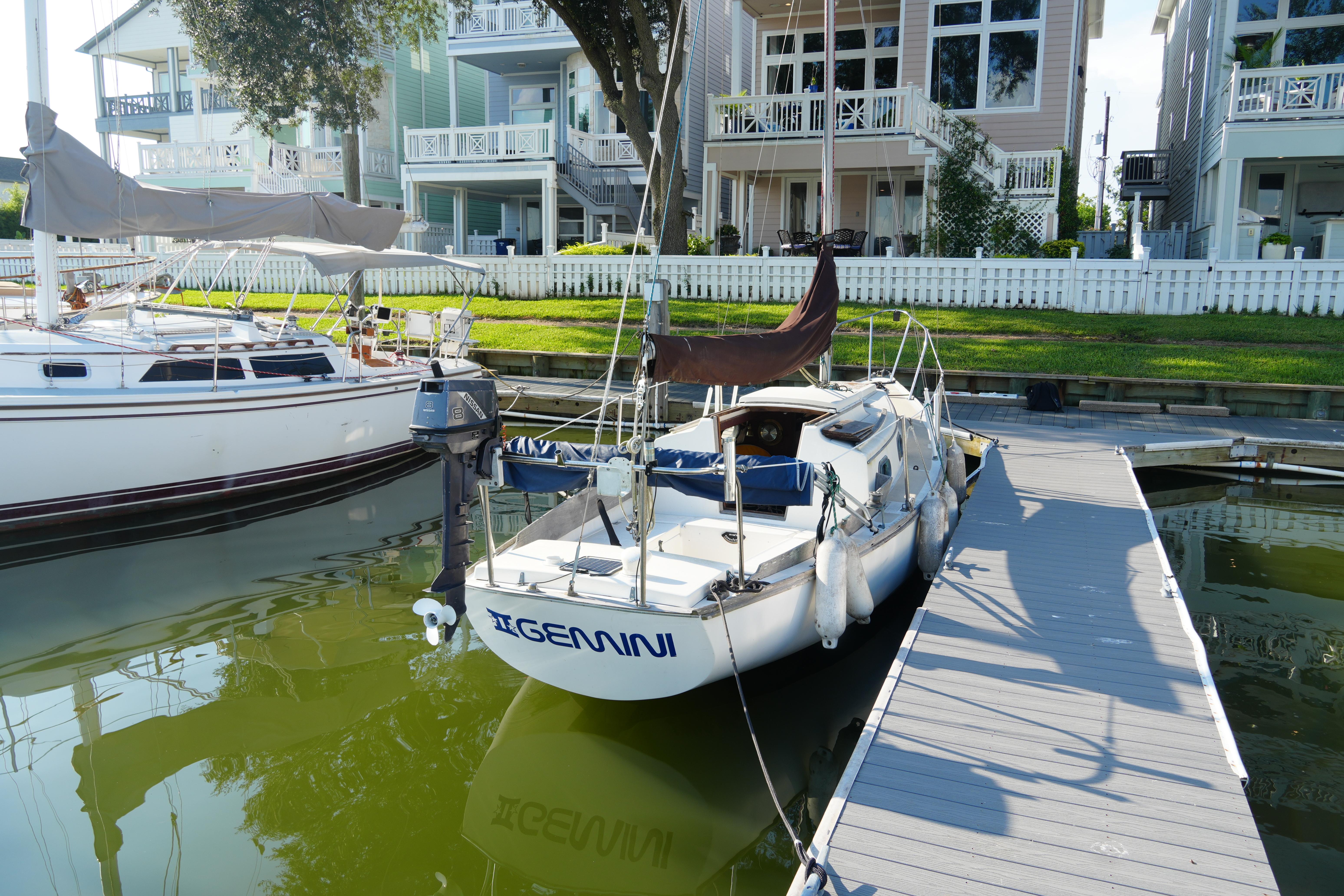 Cape Dory 25 1982 Cape Dory 25 sailboat docked near waterfront homes.