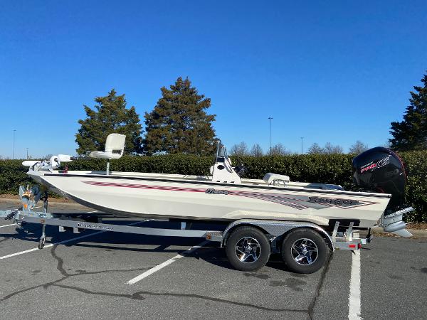 Ranger RB200 2024 Ranger RB200 boat on trailer in parking lot, clear sky background.