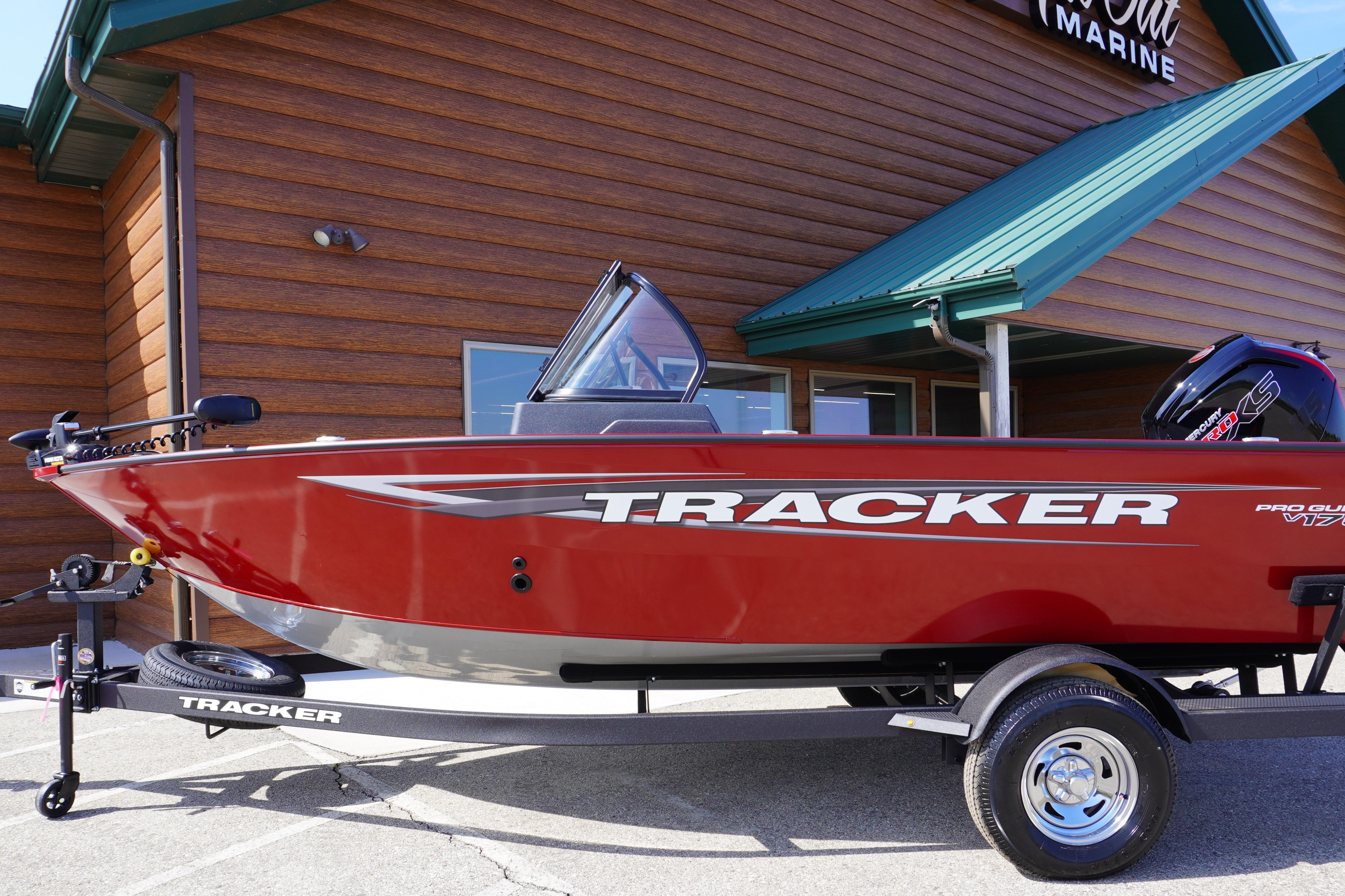 Tracker Pro Guide V-175 Combo 2025 Tracker Pro Guide V-175 Combo boat on trailer, red exterior, parked outside.