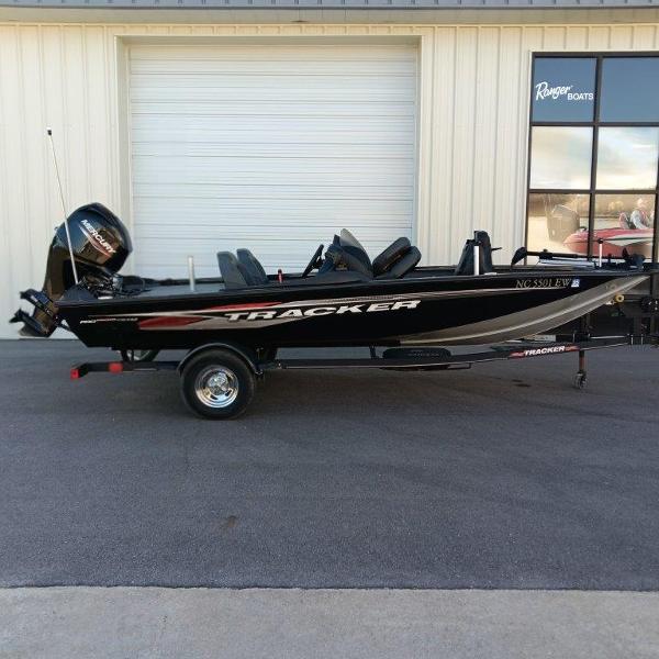 Tracker Pro Team 175 TXW 2022 Tracker Pro Team 175 TXW boat on trailer, parked outside a building.