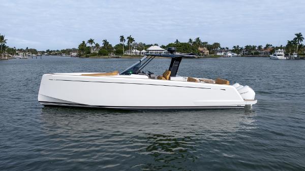Pardo Yachts 38 2024 Pardo Yachts P38 cruising on a serene waterway with palm trees in the background.