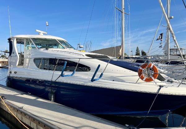 Sea Ray 390 Motor Yacht 2005 Sea Ray 390 Motor Yacht docked at marina, featuring sleek design and life preserver.