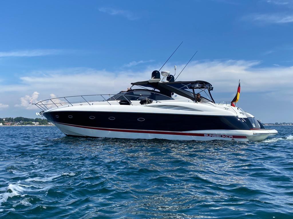 Sunseeker Camargue 50 2001 Sunseeker Camargue 50 yacht cruising on open water under a clear blue sky.